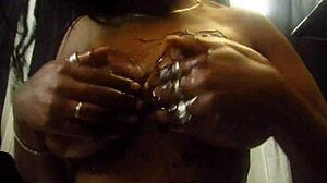 oiled chocolate ebony body shines under the light