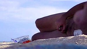 watch these voyeurs jerking off on the nude beach while hubby films cocks cumming near his wife