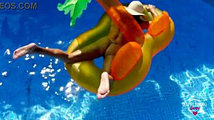 Nippleringlover tans naked in pool with huge rings in pierced pussy lips and nipples. So kinky and horny!