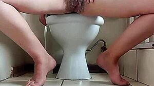 filming my stepmom shaving her pussy while she touches herself secretly