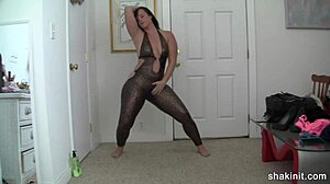 Latex suit can't contain her bouncing ass during striptease.