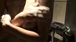 Cute blonde babe enjoys a relaxing shower with big boobs. 😊