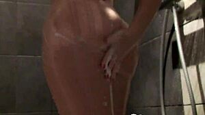 Cute blonde babe enjoys a relaxing shower with big boobs. 😊