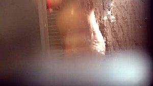 Girl caught bathing in the shower.