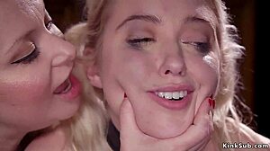 Blonde participates in bondage activities at a group event