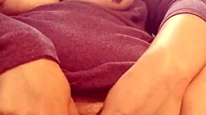 Redhead squirting her pussy in masturbation.