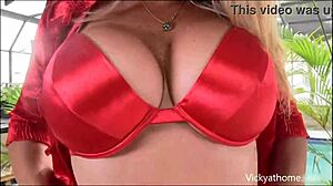 Juicy Vicky Vette teases in red lingerie while playing with toys solo. Her blonde cougar charm shines!