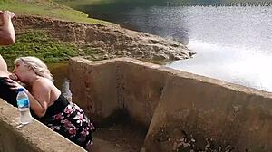 blonde slut with big ass gives blowjob in public lagoon, ends with creampie