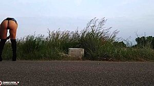 Outdoor porn shoot features small tits and shaved pussy by the roadside!