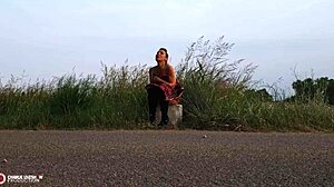 Outdoor porn shoot features small tits and shaved pussy by the roadside!