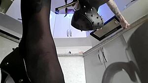 Dominatrix Nika Towers Over Small Man in Giant Fetish