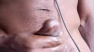Stroking big black cock intensely until cum shoots onto the floor