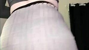 Look at that sexy redhead with a big curvy ass dancing in fishnets.