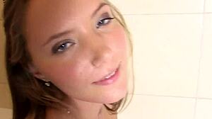 Sexy babe relaxes in bathtub with dildo