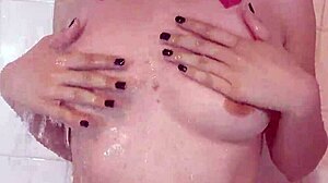 I watch this teen alt slut do a topless shower strip tease in lingerie.