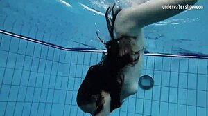Look at this small-tits teen Umora Bajankina bathing underwater!