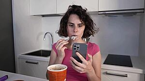 darcy dark eats ice cream in the kitchen while masturbating her pussy.