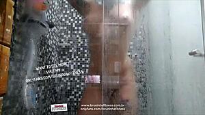 Naughty beauty bathes, plays with big black cock, inserts dildo in ass.