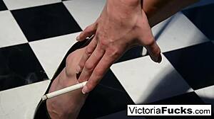 Victoria white stretches out her long legs and smokes casually