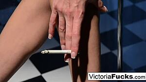 Victoria white stretches out her long legs and smokes casually