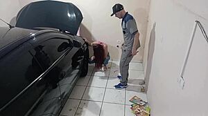 Employee Fixes Car in Workshop
