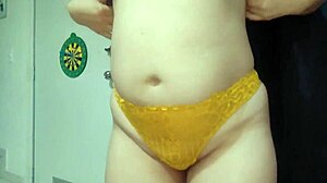 Milf enjoys double penetration with strap on in threesome