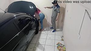 Employee Fixes Car in Workshop