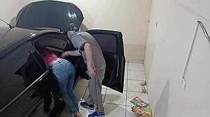 Employee Fixes Car in Workshop