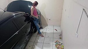 Employee Fixes Car in Workshop