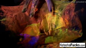 Busty natasha nice creates a fun and sexy black light video shoot