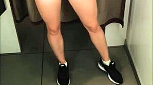 A girl with a perfect figure in a dressing room trying on different swimwear