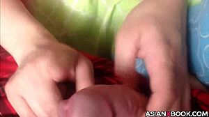 Asian babe gives a nice handjob