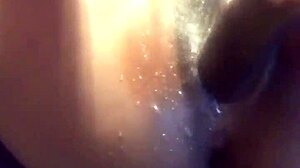 ebony babe squirts with dildo and toys