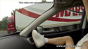 A daring amateur engages in flashing and masturbation while driving on the highway.