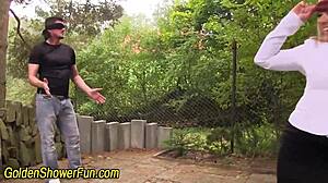 Slut gets urine and spunk on face.