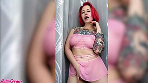 sexy tattooed redhead amateur plays with her pussy using a sex toy
