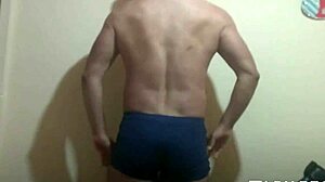 Athletic swinger poses in bathroom, dances striptease, masturbates to erection