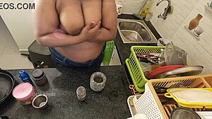 My girlfriend massaging her boobs with oil in the kitchen