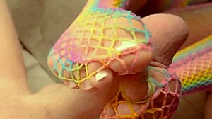 Latina milf gives footjob and plays with pussy.