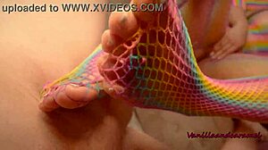 Latina milf gives footjob and plays with pussy.