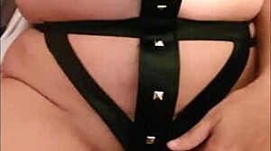 Wife in leather dress receives cumshot inside during kinky couple sex.