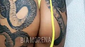 Brazilian sensual tattooed girl shows off her body nicely