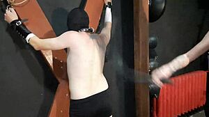 Mistress Whips Crying Slave on Cross