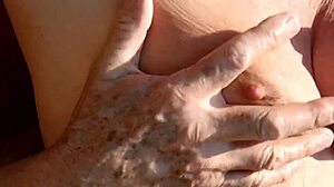 K and her natural tits in the calm morning nature setting.