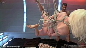 The suspended blond gets ROUGHLY FUCKED and WHIPPED in bondage session