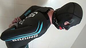 Angela, that neoprene slave milf, getting wet in the shower.