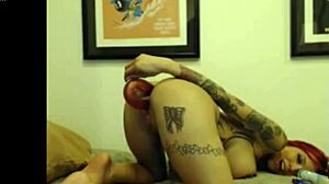 tattooed cam girl teasing with dildo in pussy and ass