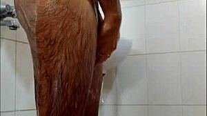 Guy feels intense pleasure masturbating in shower, reaching orgasm