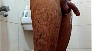 Guy feels intense pleasure masturbating in shower, reaching orgasm