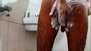 Guy feels intense pleasure masturbating in shower, reaching orgasm